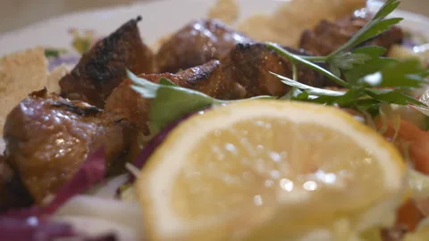 A close up view of grilled lamb kebab with salad. Stock Footage 142550438