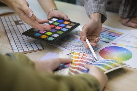 Close up view group of creative people working on new project together. Stock Photos