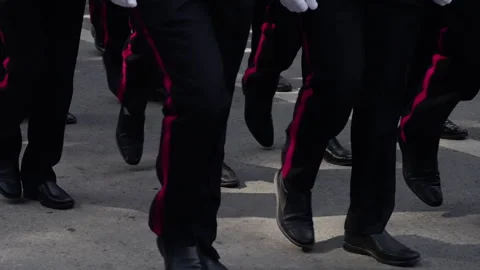 Close-up view of a group marching in unison, focusing on synchronized footsteps Stock Footage 312675453