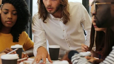Close up view of a group of multiethnic friends discussing different issues and Stock Footage 82589720