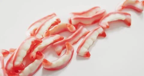Close up view of halloween sour patch candies fallen against grey background Stock Photos