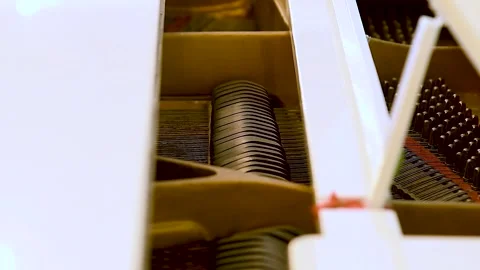 Close-up view of hammers and strings inside the upright piano. Stock Footage 310045228