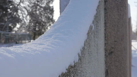 Close Up View Of Hand Brushed Away The Snow From Snow-Covered Fence Stock Footage 122856646