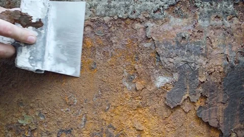 Close-up view - the hand is cleaning the rust. Stock Footage 160883473