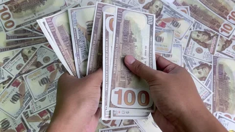 A close-up view of a hand counting dollar bills. Stock Footage 326805350
