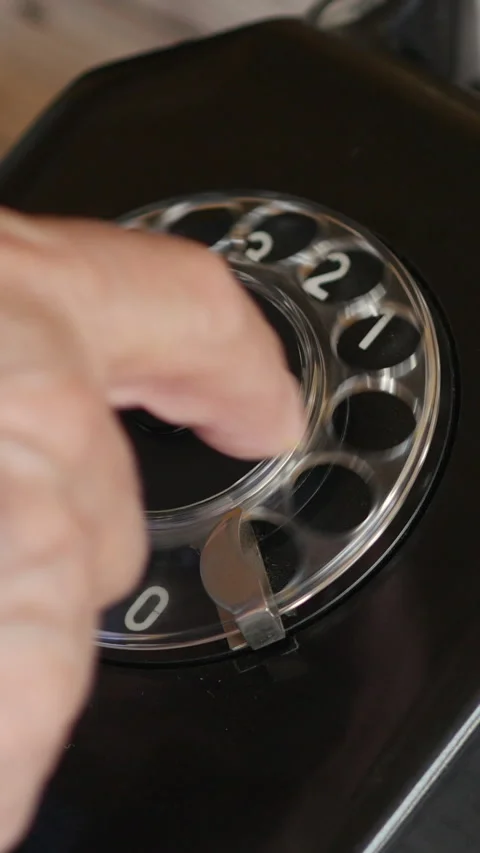 Close View Of Hand Dialing Number On Rotary Phone. Vertical. Video stock 304417784
