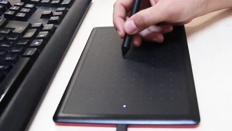 A Close View Of The Hand Drawing On The Graphic Tablet O Stock Footage 164968379