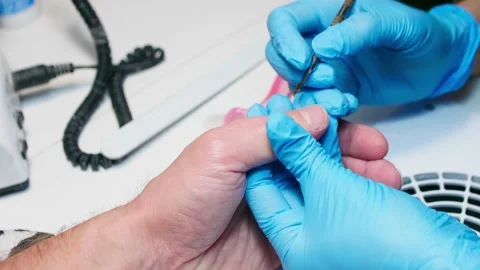 Close up view of hand during procedure of manicure. Manicurist pushes back Stock Footage 146645018