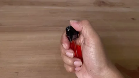 Close up view of hand flick a Lighter Stock-Footage 345587440