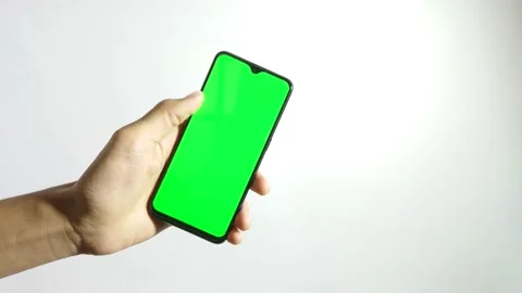 Close Up View Of A Hand Holding and swipe the phone with Green Chroma Key Screen Stock Footage 145470033