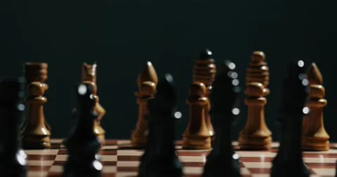 Close up view of the hand of a man playing chess queen move Stock Footage 131084278