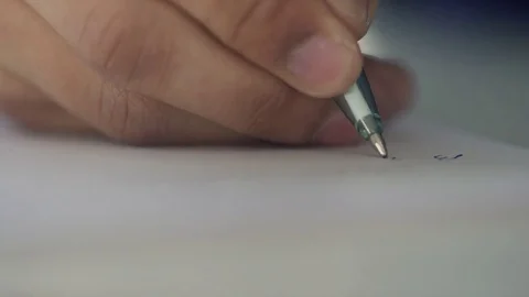 Close-up view on hand of man writing letter on paper indoors. Video stock 77219207