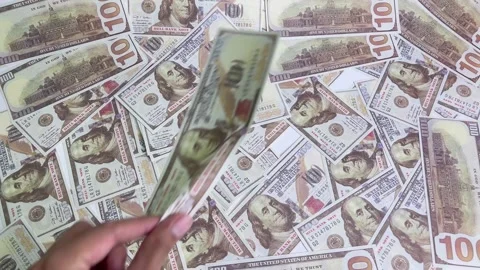 Close-up view of a hand picking up a dollar bill. Stock Footage 326805495