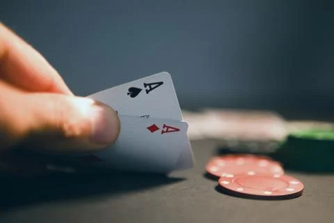Close up view of hand playing cards on table with casino chips. gambling co.. Photos