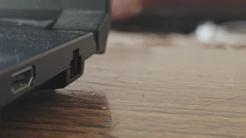 Close up view of a hand plugging and unplugging a gray ethernet lan cable Stock Footage 346771609