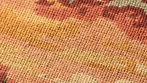 Close-up view of a hand-woven tapestry, colorful textile elements. Tapestry weav Stockbeeldmateriaal 284428770