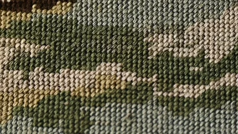 Close-up view of a hand-woven tapestry, colorful textile elements. Tapestry weav Stockbeeldmateriaal 284428781
