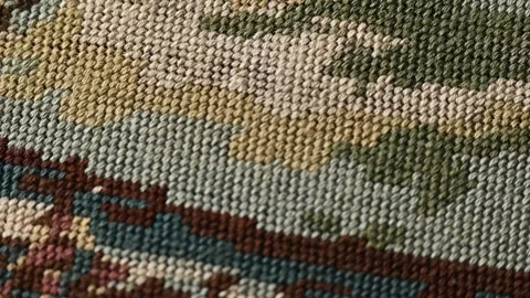 Close-up view of a hand-woven tapestry, colorful textile elements. Tapestry weav Stock Footage 284431408