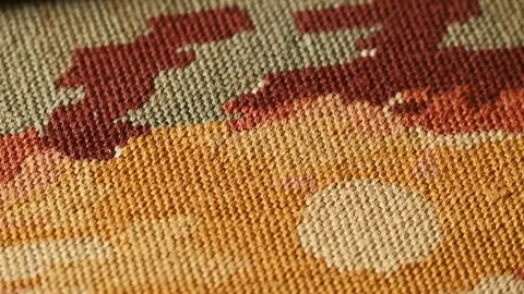 Close-up view of a hand-woven tapestry, colorful textile elements. Tapestry weav Stockbeeldmateriaal 284431495