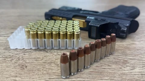 Close-up view of a handgun with ammunition Stock Footage 294722969