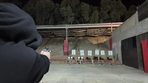 Close-up view of a handgun with ammunition Stock Footage 297287899