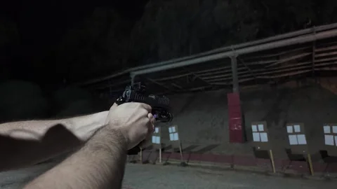 Close-up view of a handgun with ammunition Stock Footage 297289472