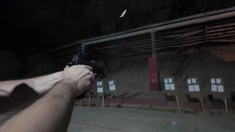 Close-up view of a handgun with ammunition Video stock 297289475