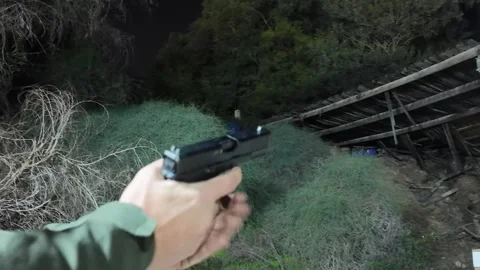 Close-up view of a handgun with ammunition Stock Footage 297289695