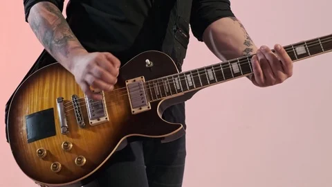 Close-up view of hands and strings of electric musical instruments indoors. Stock Footage 115070929