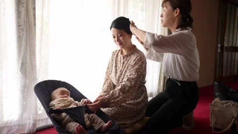 Close view of hands arranging a formal hairstyle Stock-Footage 344013153
