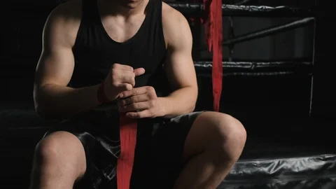 Close up view of hands of athletic body guy boxer of European appearance putting Stock Footage 110725015