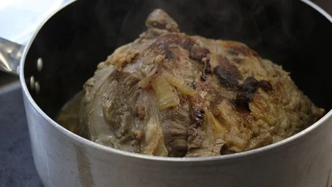 Close-up view of the hands of the chef preparing braised beef in the pot Stock Footage 122160909