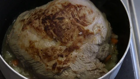 Close-up view of the hands of the chef preparing braised beef in the pot Stock Footage 122160923