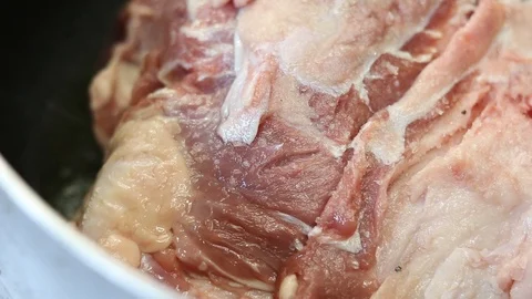 Close-up view of the hands of the chef preparing braised beef in the pot Stock Footage 122171966