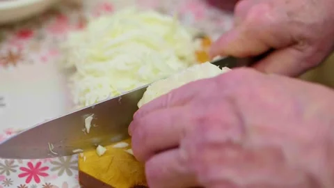 Close up view of hands chopping cabbage on wooden cut board. Process of cooking Stock-Footage 149298475
