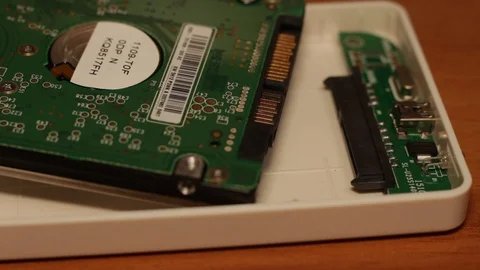 Close-up view of hands connecting an internal hard drive to an external usb box 스톡 동영상 126138546