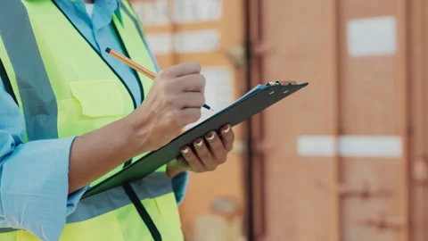 Close-Up View Of The Hands Of Female Inspector Writing Information On Clipboard Stock Footage 309989134