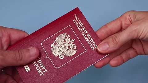 Close up view of hands holding russian passport. Stock Footage 289753115