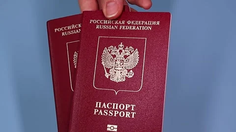 Close up view of hands holding russian passport. Stock Footage 289753245