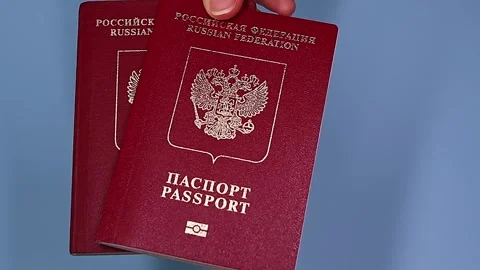 Close up view of hands holding russian passport. Stock Footage 289753275