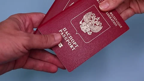 Close up view of hands holding russian passport. Stock Footage 289753313