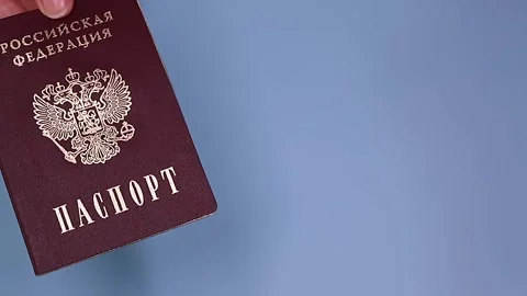 Close up view of hands holding russian passport. Stock Footage 289753389