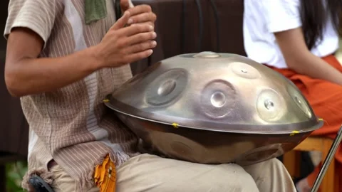 Close-up view of the hands man playing handpan in nature. Stock-Footage 208693849
