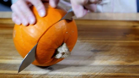 A close-up view of the hands of a man preparing the decorations for Hallowe.. Stock Footage 272459683