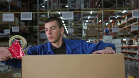 Close up view of the hands of a manufacturing worker packed products in Stock Footage 116997139