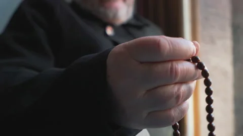 Close-up view of hands of a Muslim old man holding a rosary Stock Footage 147456372