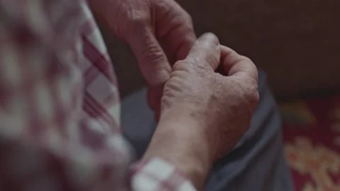 Close-up view of the hands of a Muslim old man holding a rosary. Stock Footage 170036299