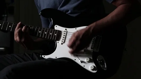 Close-up view of hands playing electric guitar Stock Footage 79575439
