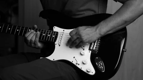 Close-up view of hands playing electric guitar Stock Footage 79588983