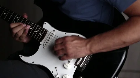 Close-up view of hands playing electric guitar Stock Footage 79589000